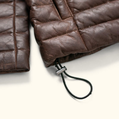 Authentic Buffalo Jackson Bridger Leather Down Jacket detail showing adjustable cinch toggles on the bottom hem